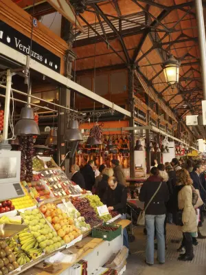 Sample authentic Spanish tapas and gourmet food in a historic covered market